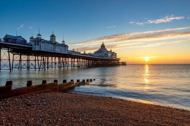 Eastbourne beach, at sunset, with pier